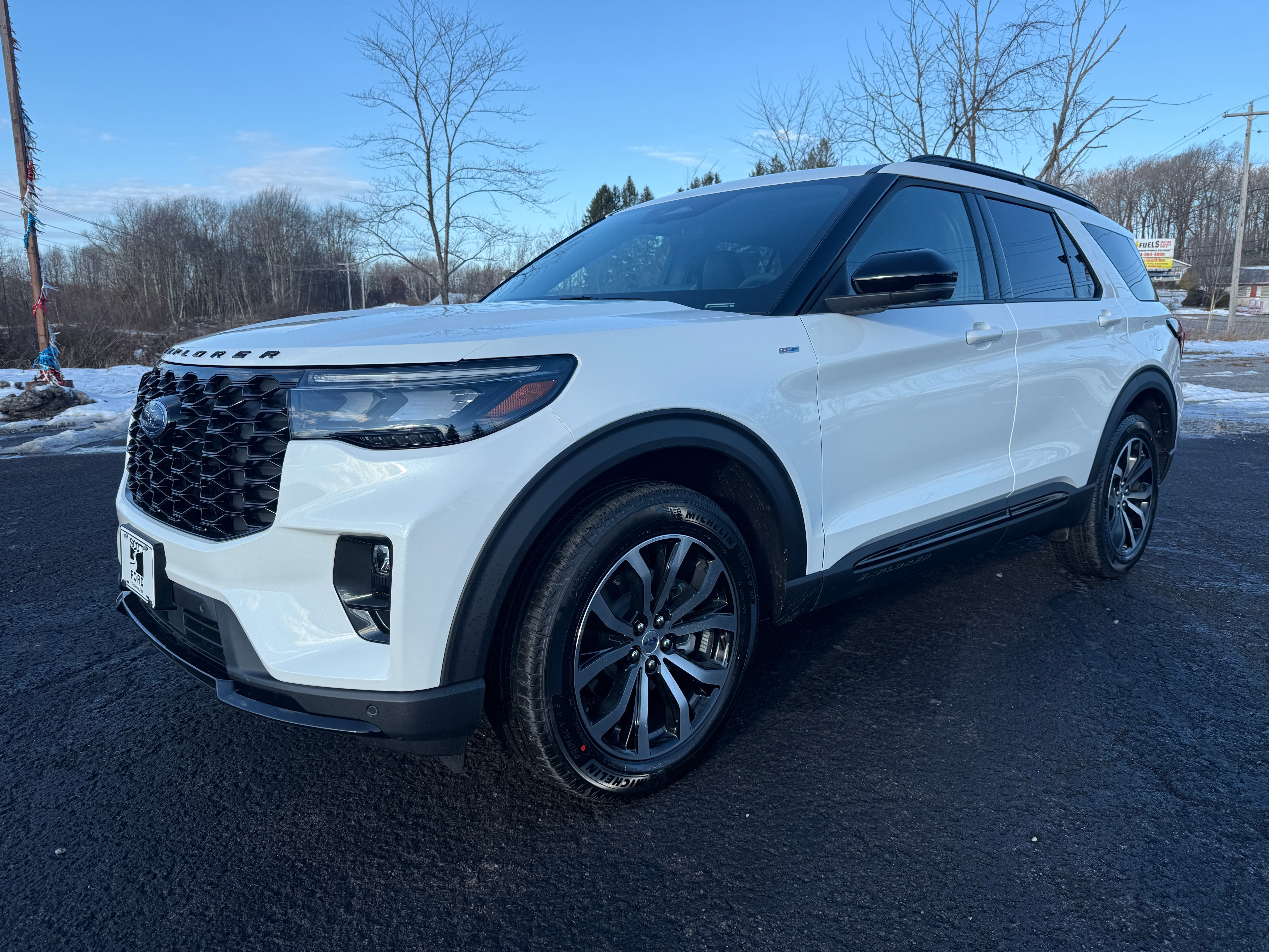 2026 Ford Explorer ST-Line 4WD in Star White Metallic Tri-Coat — front three-quarter view