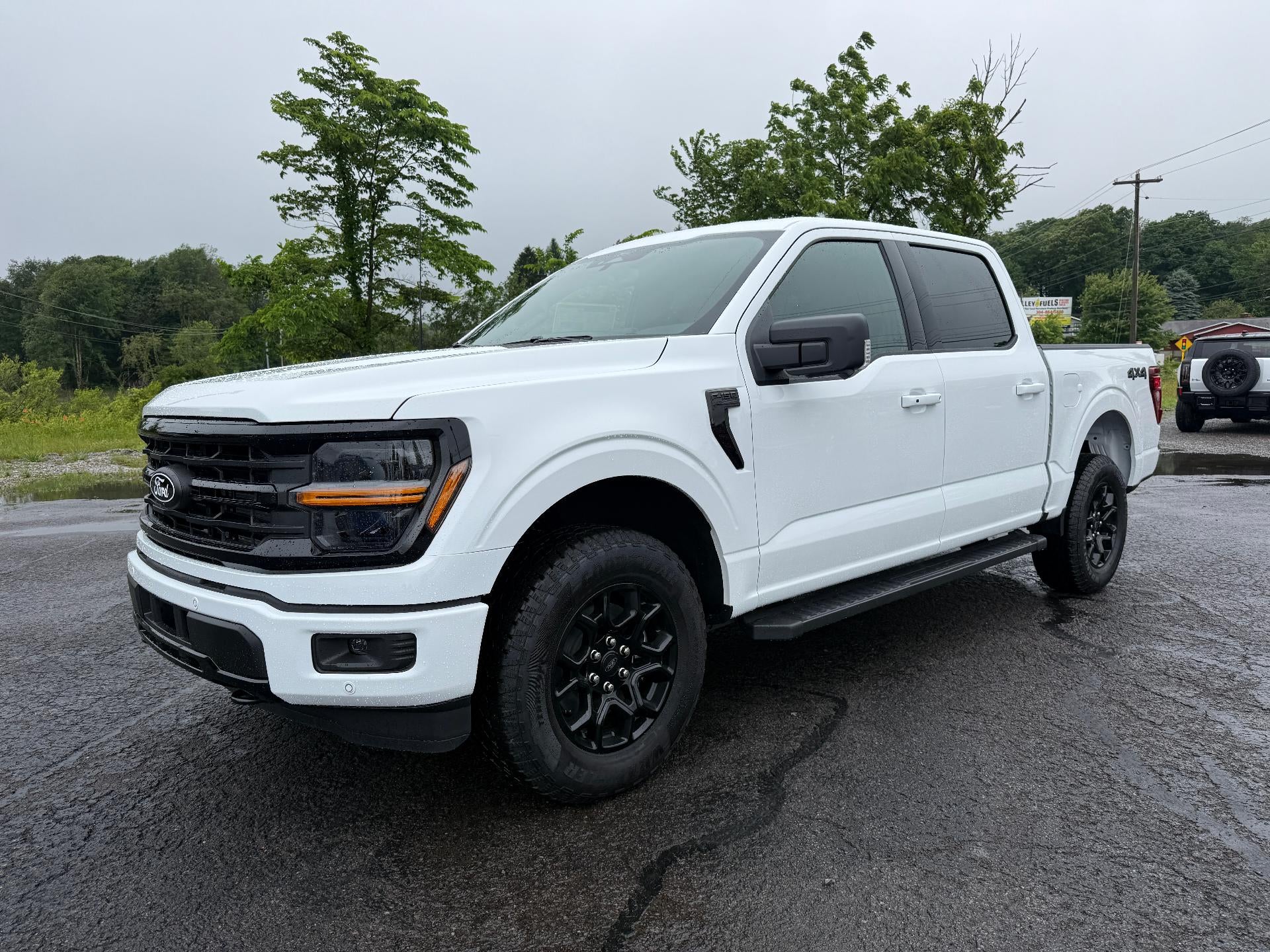 2026 Ford F-150 XLT 4WD SuperCrew 5.5' Box in Oxford White — front three-quarter view