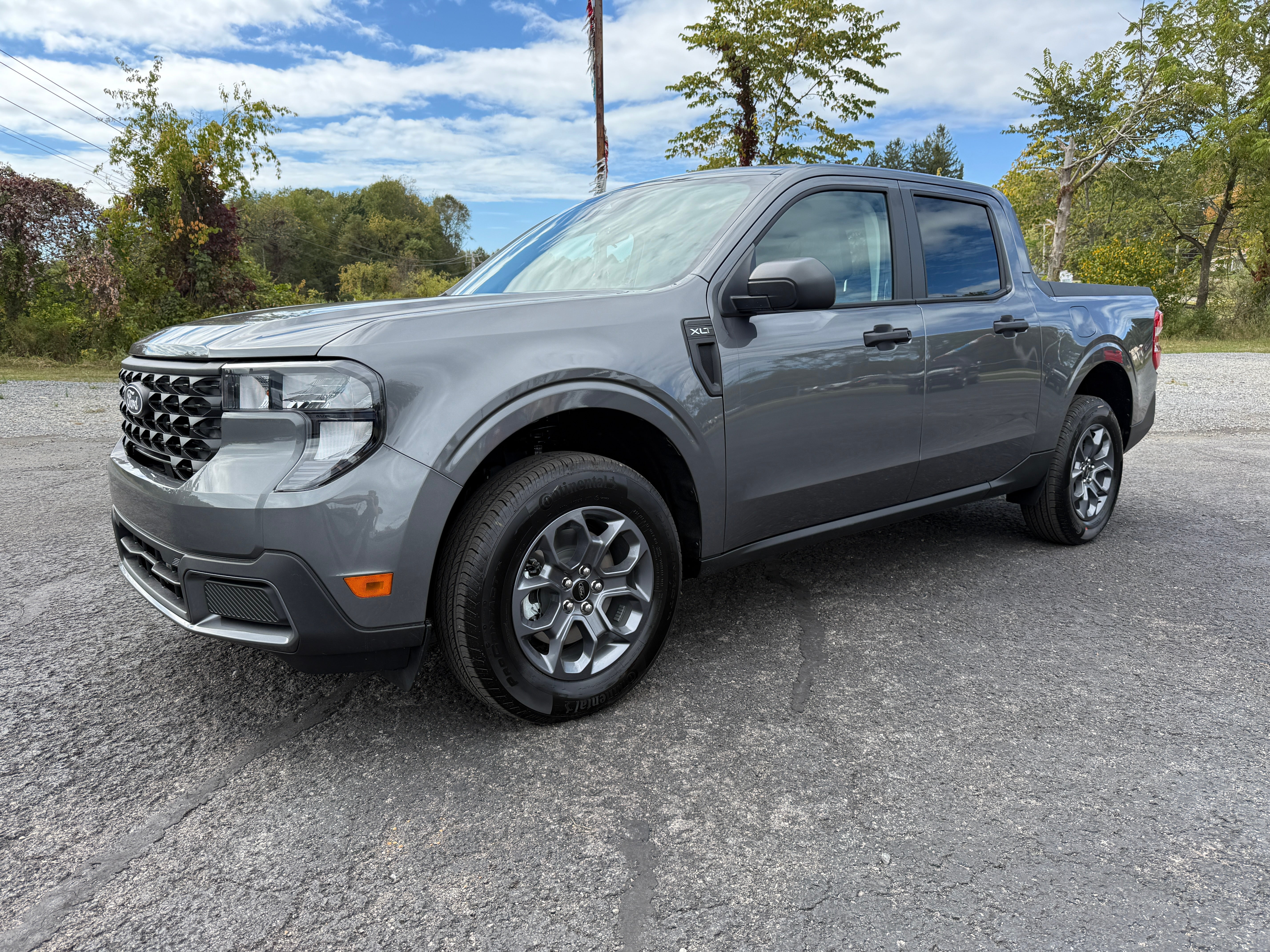 2025 Ford Maverick XLT AWD SuperCrew in Carbonized Gray Metallic — front three-quarter view