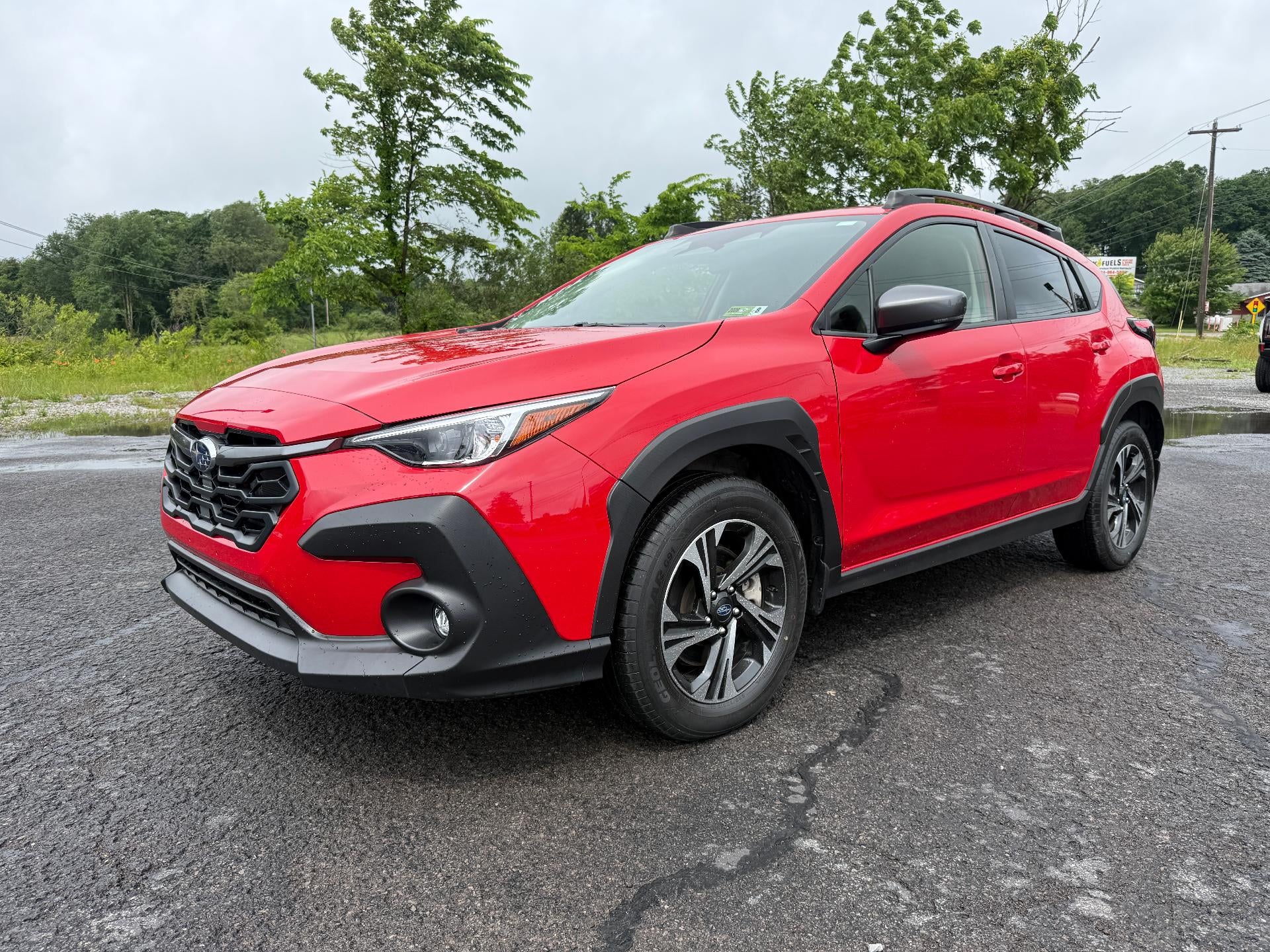 2024 Subaru Crosstrek Premium AWD in Pure Red — front three-quarter view